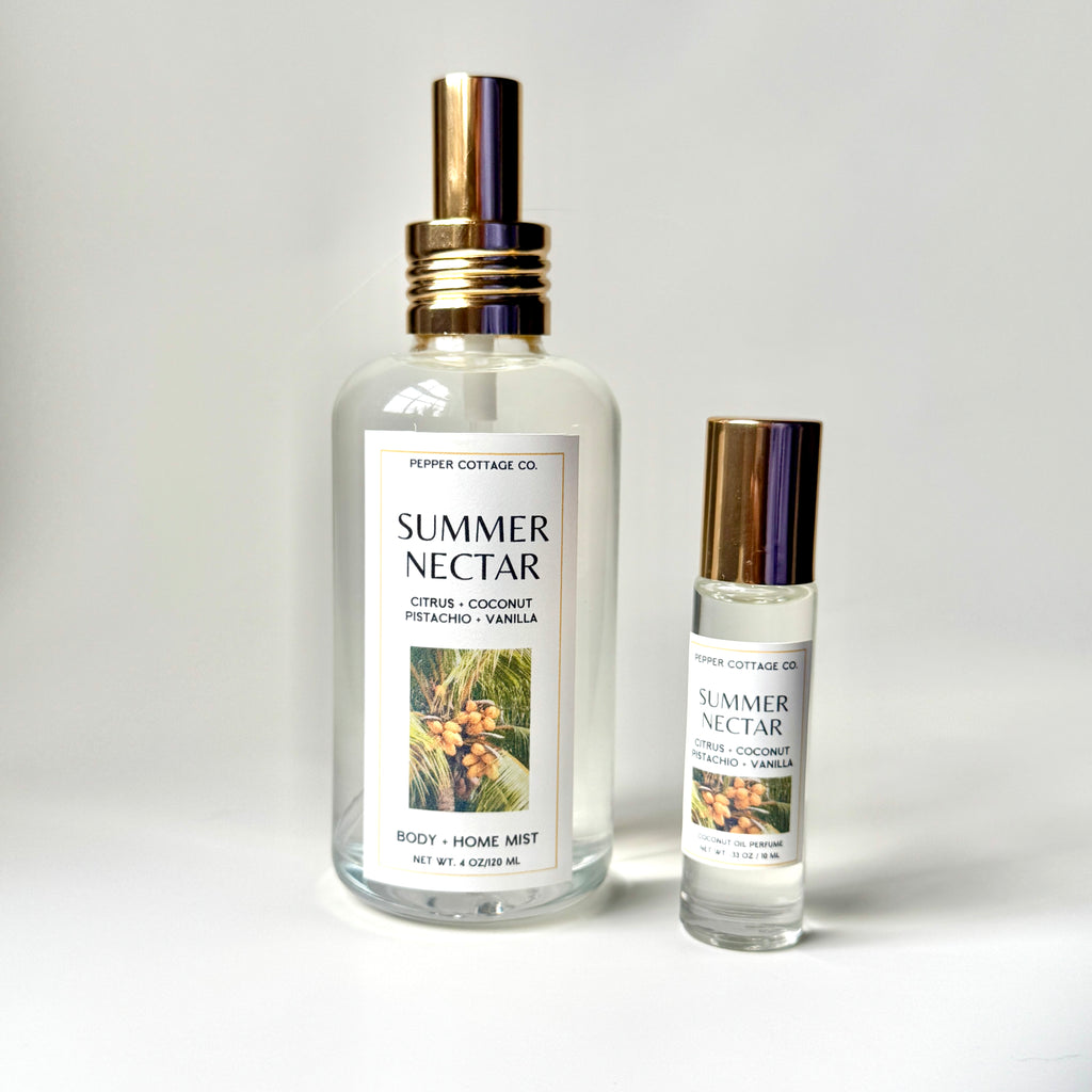 Two bottles of 'Summer Nectar' body and home mist by Peppercorn Cottage Co on a light gray background.