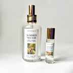 Two bottles of 'Summer Nectar' body and home mist by Peppercorn Cottage Co on a light gray background.