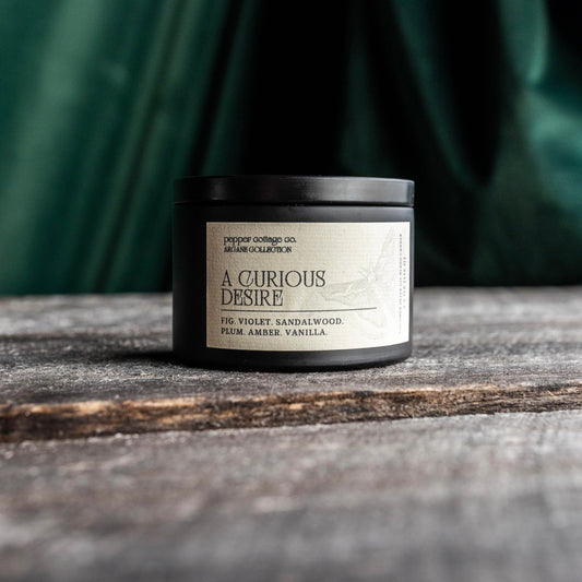 A Curious Desire 5.5 oz Candle Tin | Fig, Violet, Plum, Sandalwood, Plum, Amber, Vanilla | Dark Academia Coconut Blend Candle